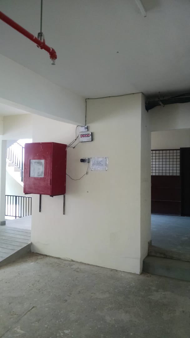 Apartment Console Display - Receiver console installed in apartment building security station for emergency monitoring.
