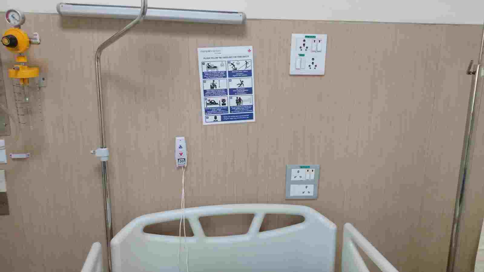 ICU Patient Call System - Patient call button installation in ICU setting with waterproof design and extended battery life.