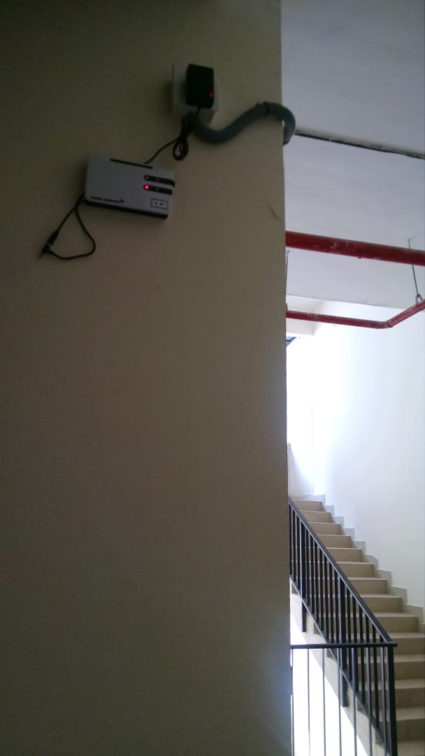 Apartment Building Repeater - Signal booster installation in residential apartment building for elderly care system.